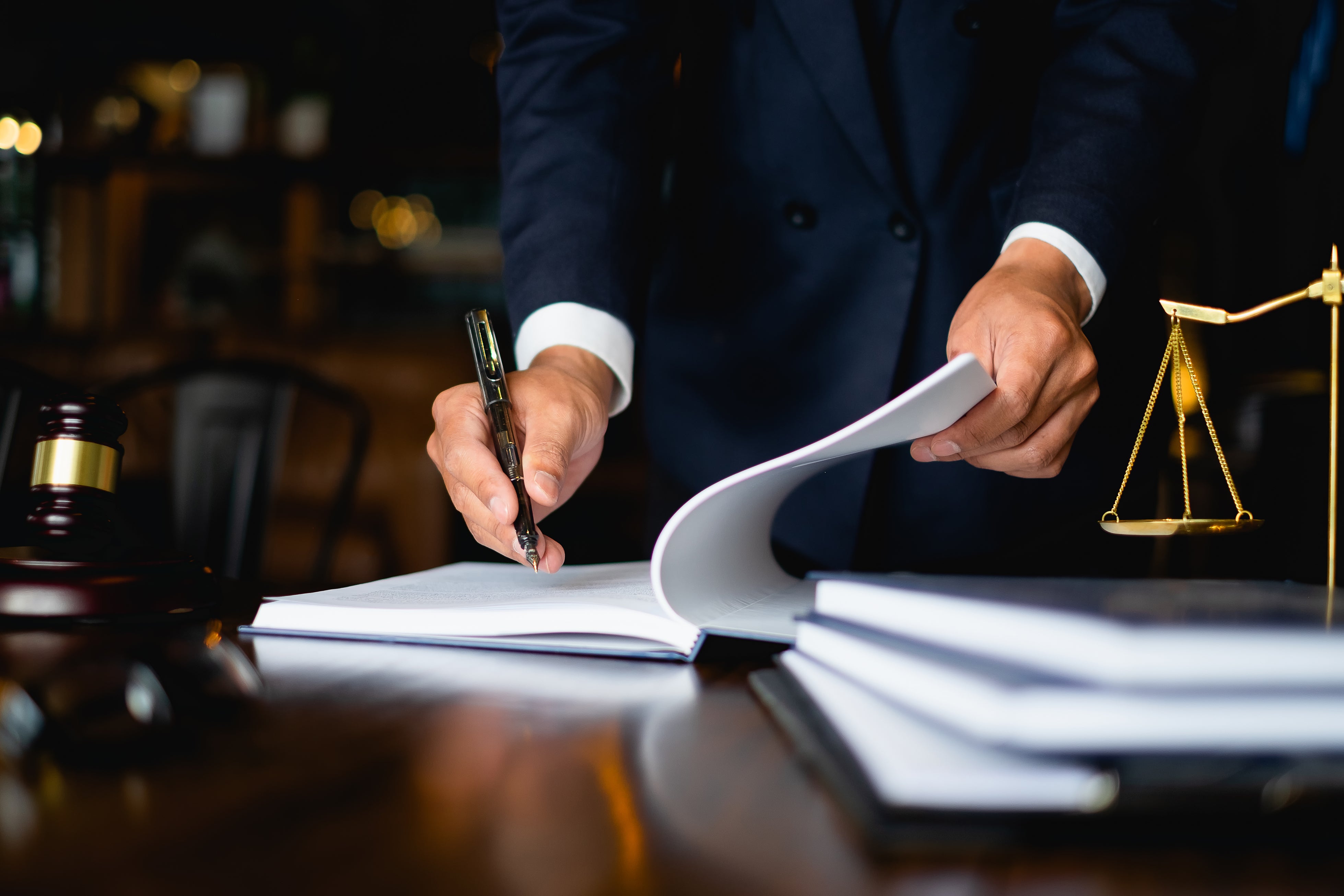 Workers compensation attorney reviewing documents with client